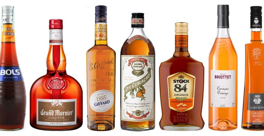 Alcune bottiglie del liquore all'arancia Orange Curaçao di diversi brand: Bols, Grand Mariner, Giffard, Ferrand, Stock, Briottet, Cartron
